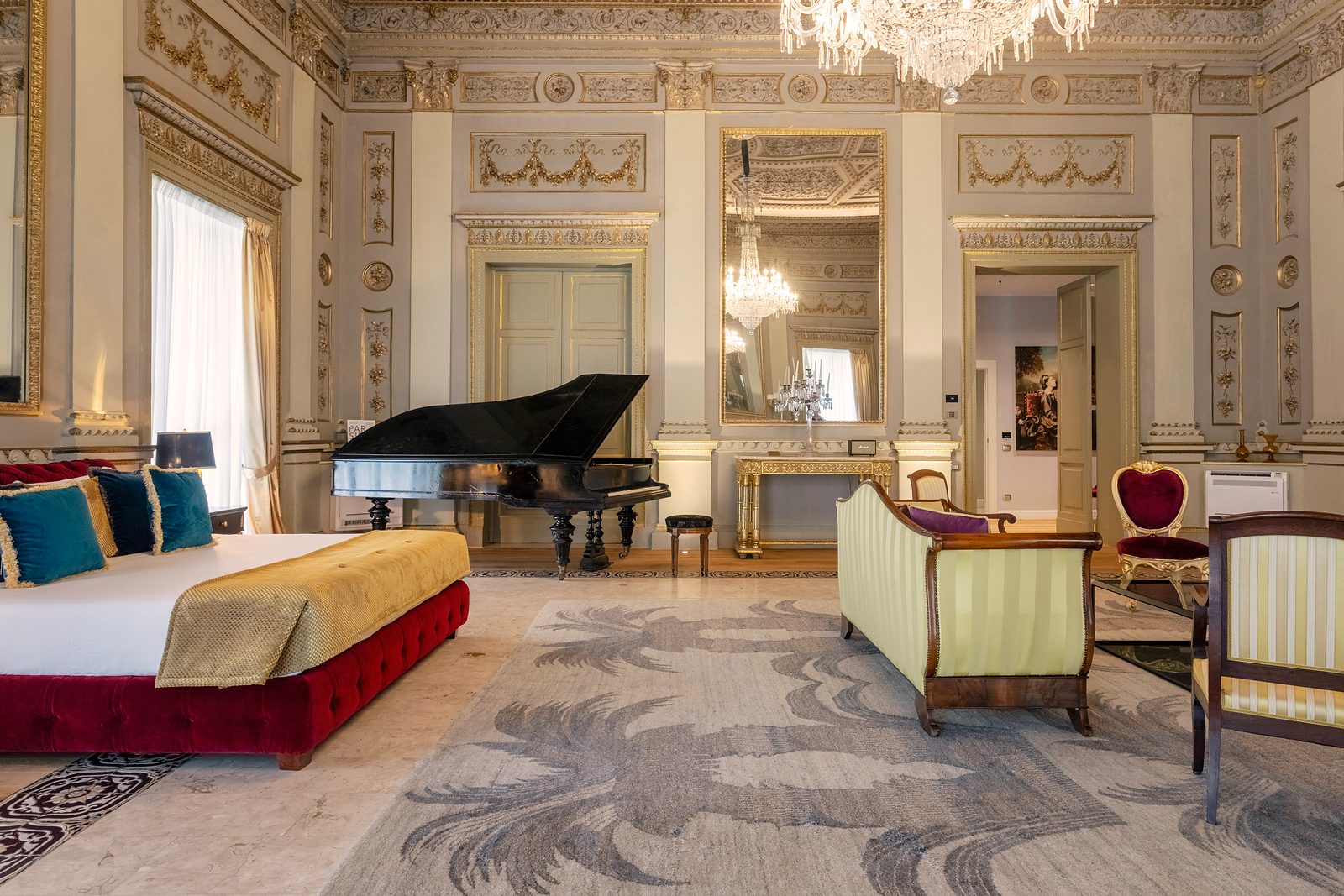 Bed, grand piano and seating in the Richard Wagner Suite at Grand Hotel et des Palmes