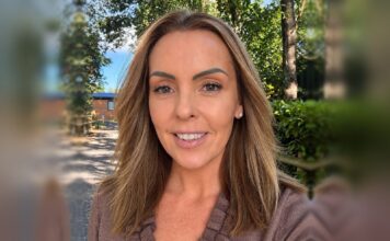 Laney Thompson, the new General Manager of Fairwood Lakes, photographed outdoors with trees and a lodge behind her