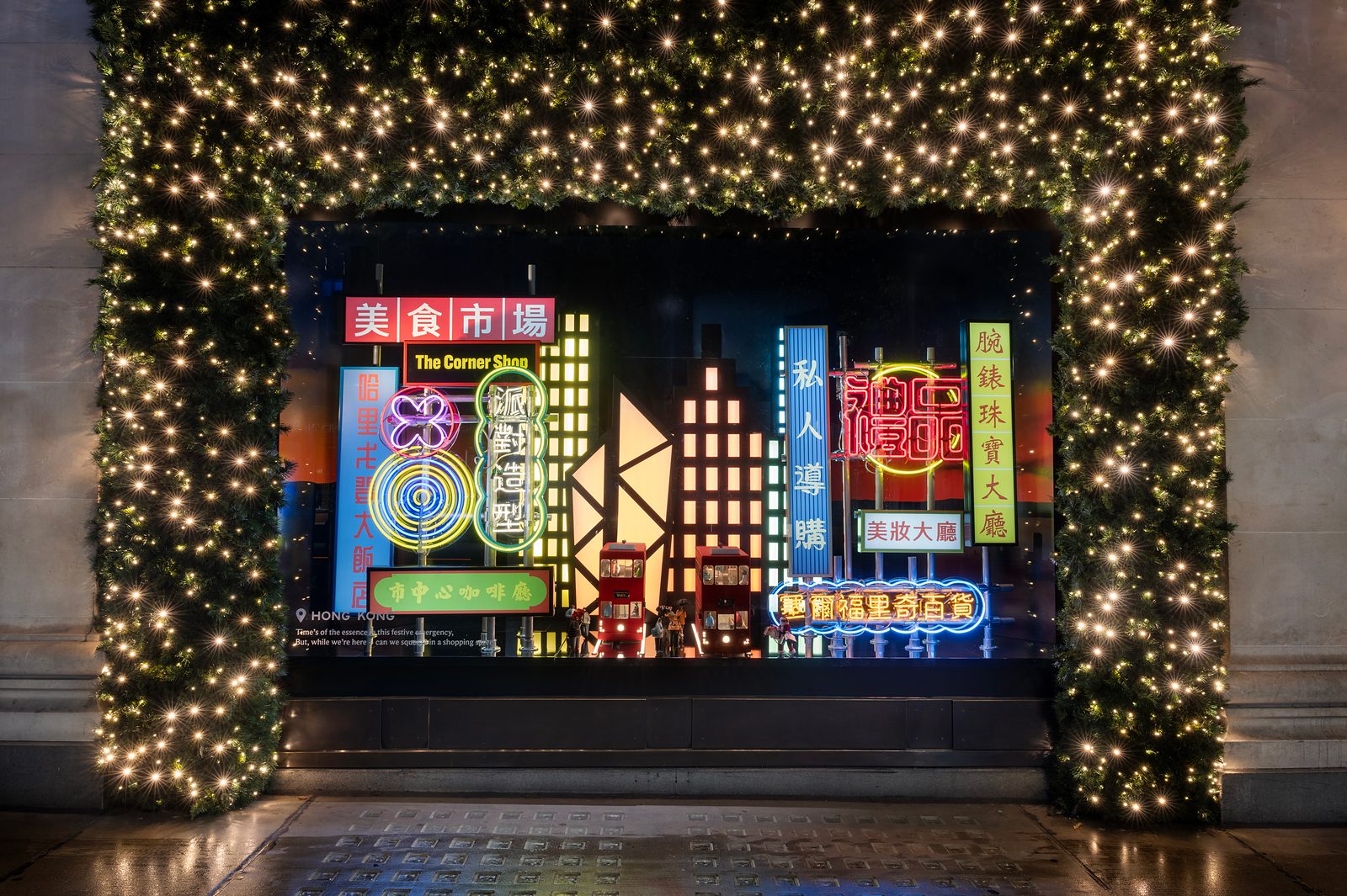Selfridges' Hong Kong Christmas window, with neon shop signs, illuminated towers and model trams